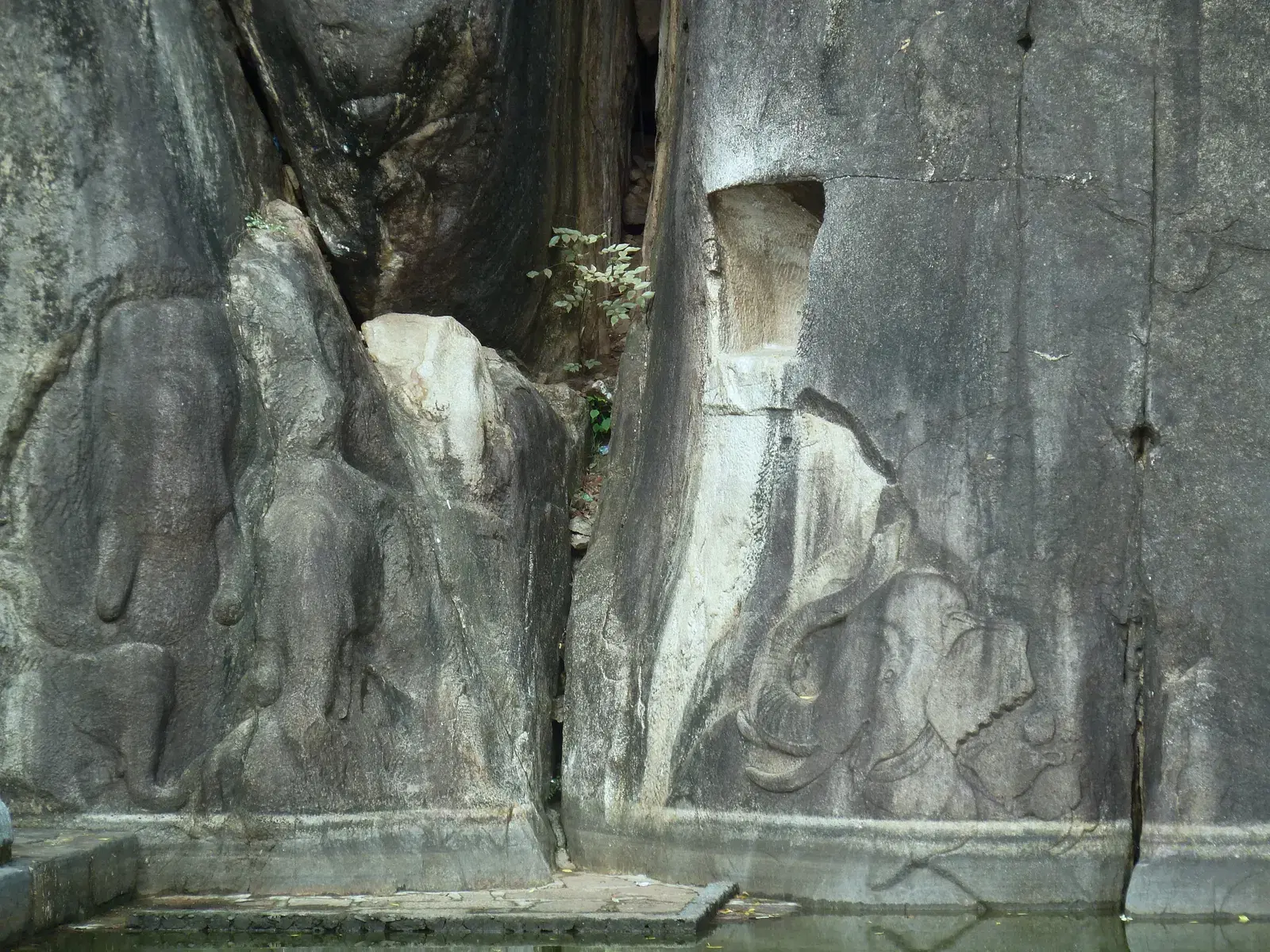 Isurumuniya Rock Temple, built into a granite outcrop beside a pond