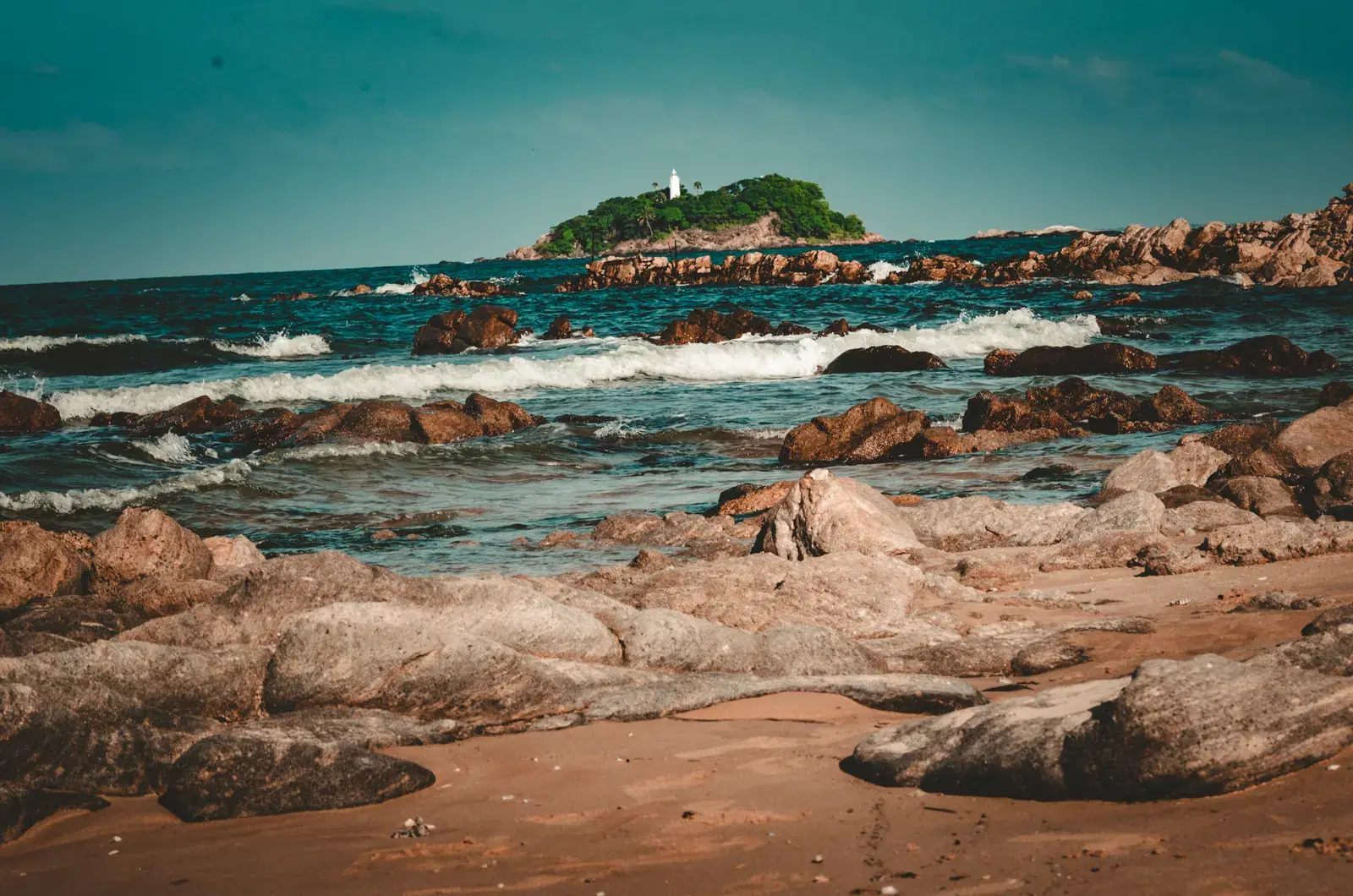 The curved bay and beach at Arugam Bay, Sri Lanka's east coast surf town