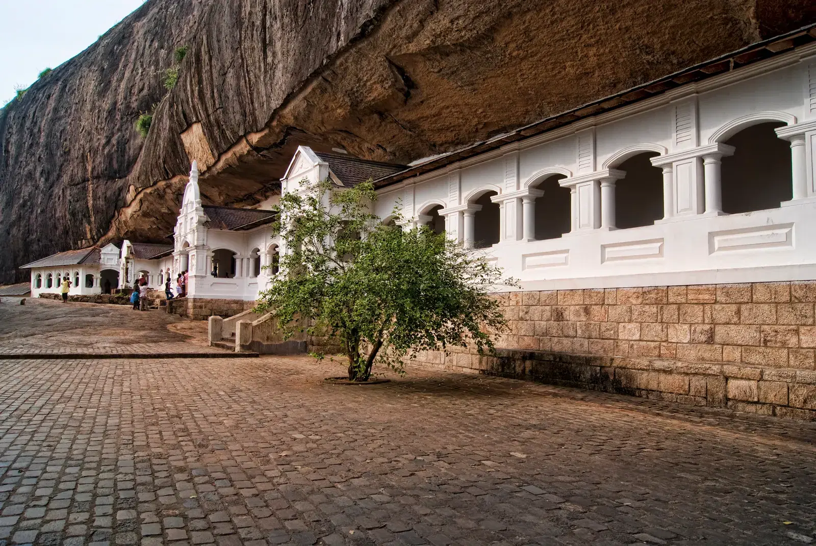 Painted murals covering the ceiling inside a Dambulla cave