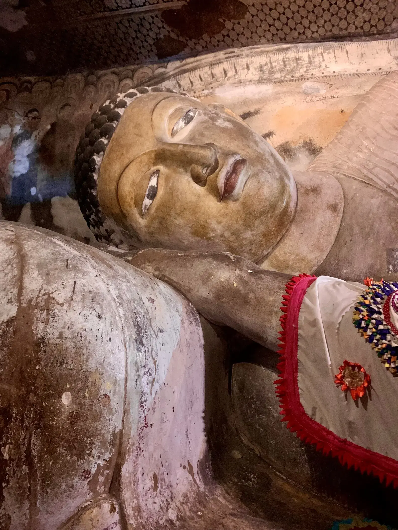 A reclining Buddha statue inside the Dambulla cave temple