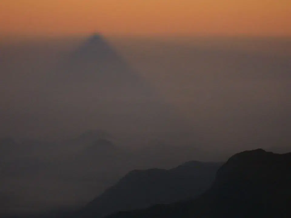 The triangular shadow cast by Adam's Peak at sunrise