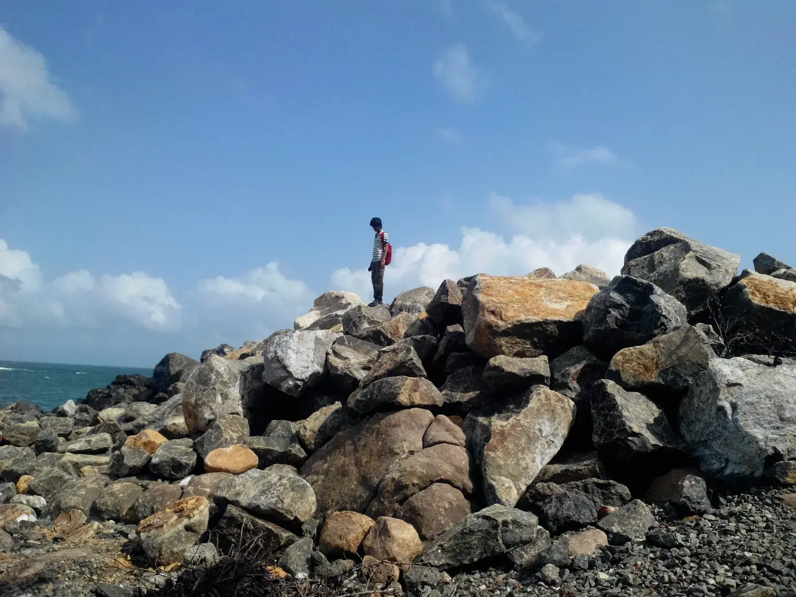 Unawatuna's curved bay beach with the rock outcrop at one end