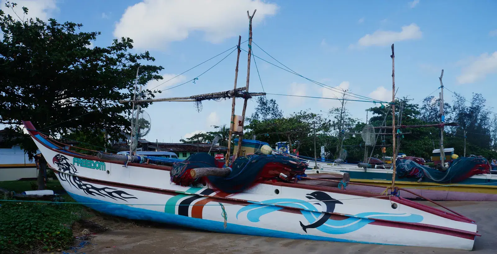 Outrigger canoes lined up on Weligama beach